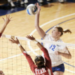 Image of playing volleyball depicting the most necessary volleyball protective gear