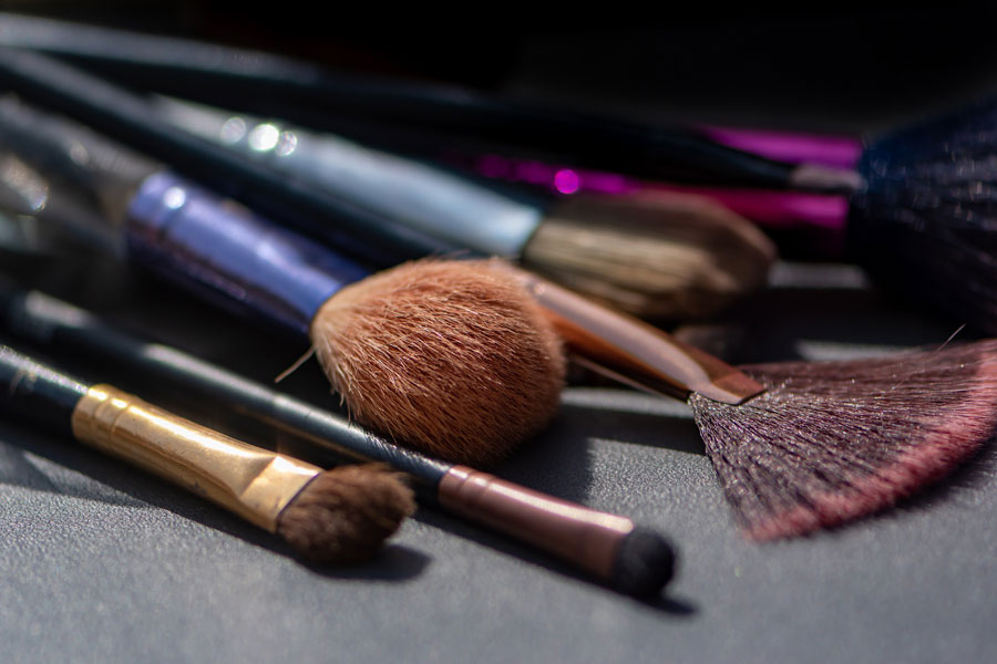 Image of a set of makeup brushes including foundation brush, concealer brush, blending brush and more to depict essential makeup brushes for beginners