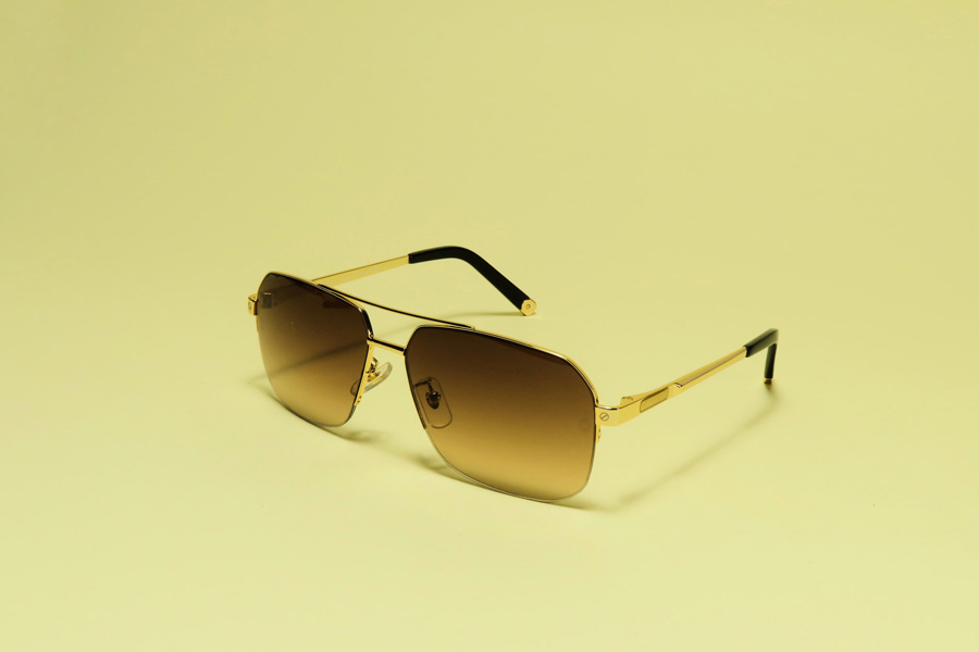 A pair of aviator sunglasses denoting the trending sunglass styles