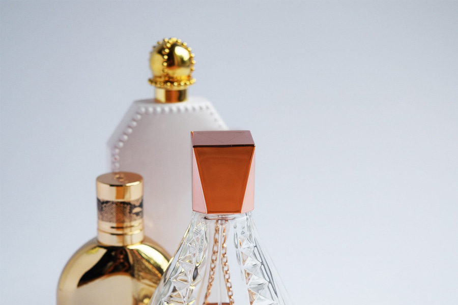 Three bottles of women’s perfumes denoting the perfume brands for women