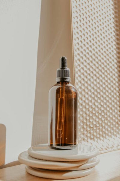 Image of a glass bottle filled with argan oil