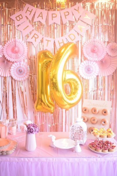Image of a girl’s sweet sixteen birthday party decorated with must have birthday party decoration items