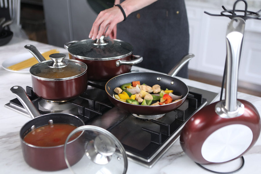 Image of a person cooking with nonstick cookware set depicting the best nonstick cookware set on the market