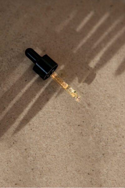 Image of a dropper with citronella essential oil depicting the benefits of citronella essential oil
