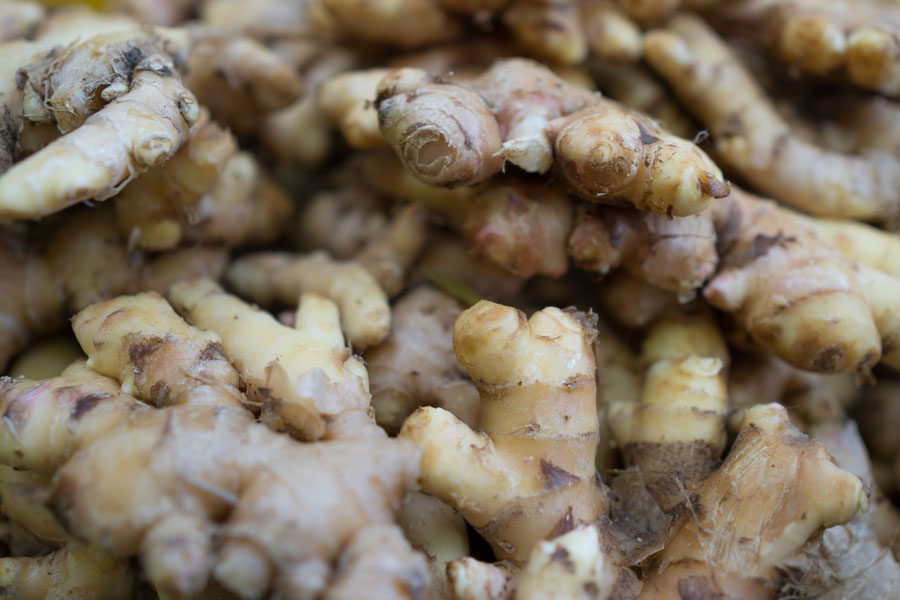 Image of a pile of ginger depicting the benefits of ginger essential oil